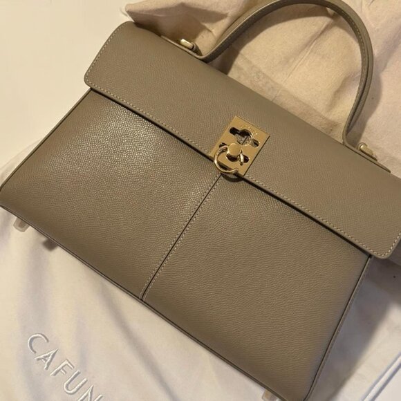 CAFUNE fine leather with clear grain pattern, paired with metal snap fasteners - Picture 1 of 5